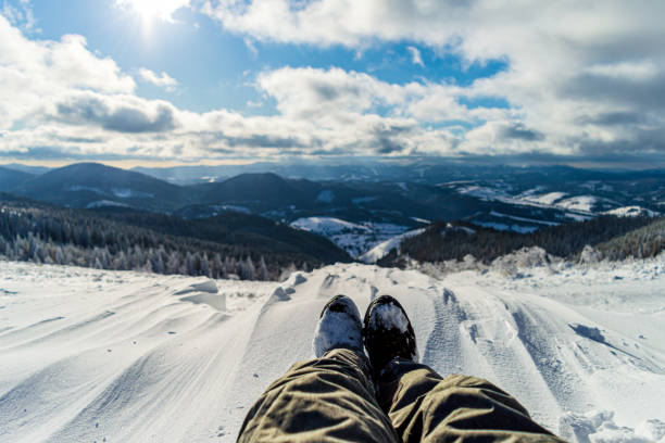 istock Traveler sitting on mountain peak 1204893851