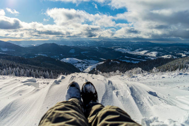 istock Traveler sitting on mountain peak 1204893863