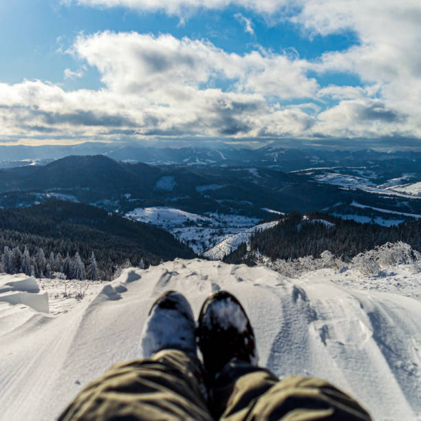 istock Traveler sitting on mountain peak 1204893864