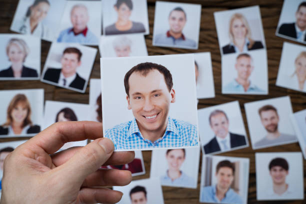istock Businessman Making Candidate Selection For Job 1204894265