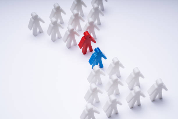 istock Two Groups Of Pawns Coming Together And Merging 1204894334
