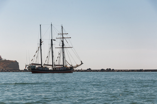 Old sailing ship anchored off the coast of Portugal. Travel concept