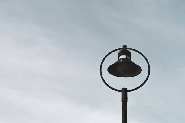 Black street lamp against a cloudy sky.  Dublin, Ireland.