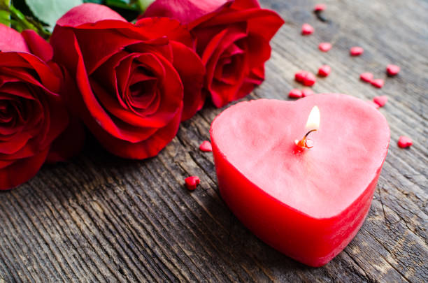 istock Red roses flowers with red hearts 1204898472