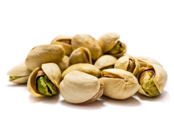 istock Pistachio nuts isolated on white background 1204900262