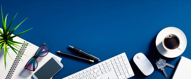 istock Top view of a blue desktop with copy space 1204904211