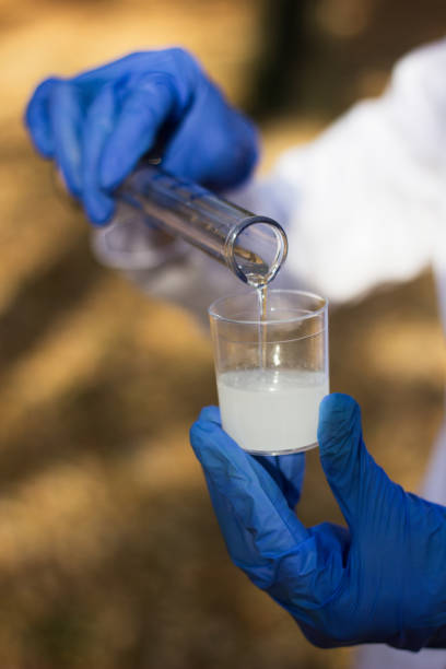 istock Female chemist with test tube 1204906074