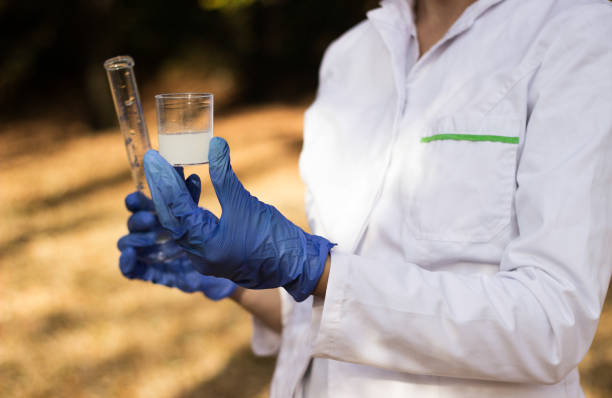 istock Female chemist with test tube 1204906202