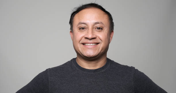 istock Smiling mature hispanic man looking at the camera 1204906338