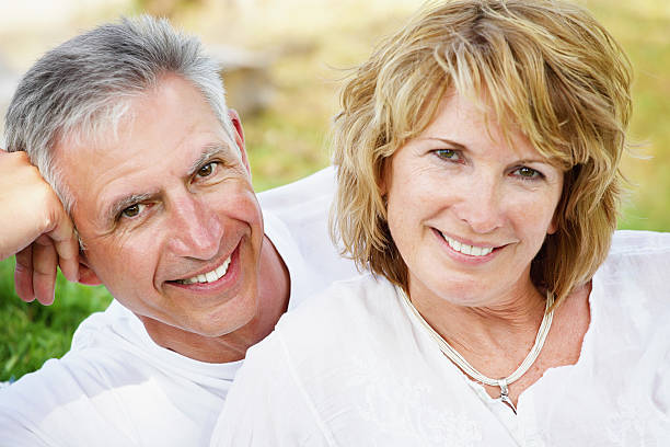 istock Mature couple dressed in white, smiling 120490738