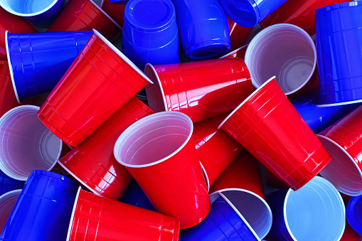 A close up image of red and blue plastic drinking cups.