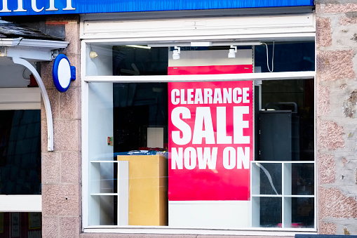 Clearance sale now on sign in shop mall window uk