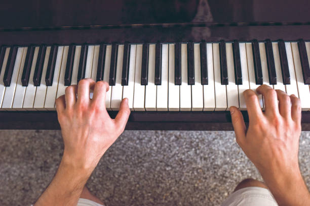 istock Man's hand playing the piano 1204922194