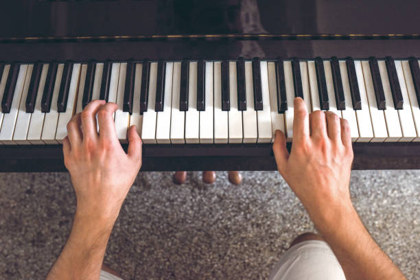 istock Man's hand playing the piano 1204922297