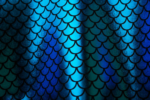 istock Reflective deep blue and cyan mermaid scale pattern print background 1204923469