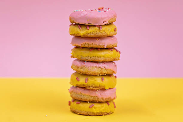 istock Stack of colorful glazed delicious donuts 1204923727