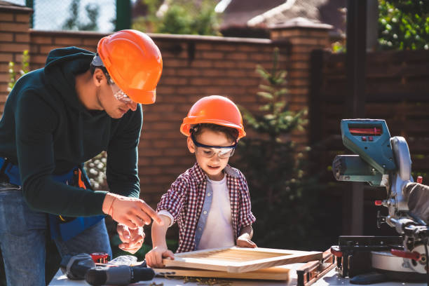 istock The father teaches his son carpentry 1204931107