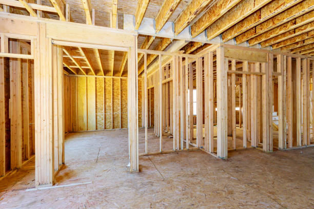 istock Home Framing unfinished wood frame building or a house 1204933168