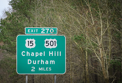 A highway sign leads people to Chapel Hill and Durham NC.