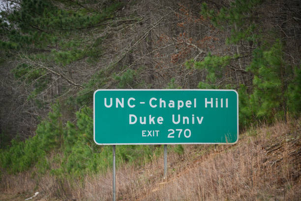 Chapel Hill/Durham NC, Highway Sign A highway sign leads people to Chapel Hill and Durham NC. university of north carolina photos stock pictures, royalty-free photos & images