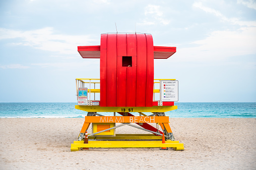 Colourful and uniquely shaped Lifeguard Beach Hut designed by William Lane on an empty Miami South Beach, Florida