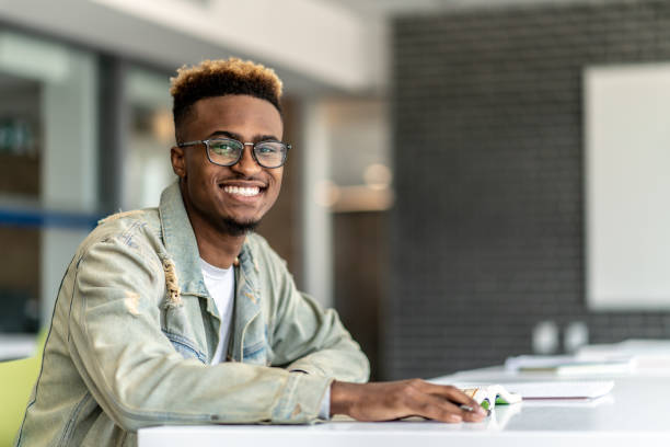istock Attractive University Student Working on Homework stock photo 1204939210