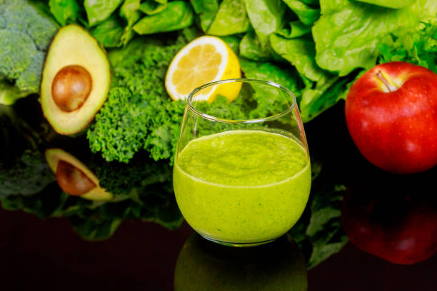 istock Vegetables healty smoothie in glass on black table. 1204944724