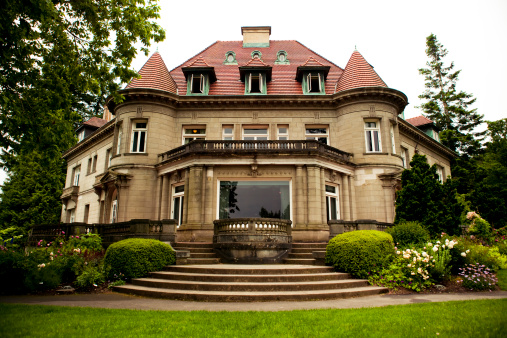 Rear view of Parkwood Estate Mansion during summer day\n\nThe Parkwood Estate, located in Oshawa, Ontario, was the residence of Samuel McLaughlin (founder of General Motors of Canada) and was home to the McLaughlin family from 1917 until 1972. Parkwood was officially designated a National Historic Site in 1989.