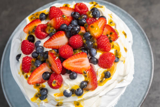 istock Pavlova dessert top down above with dark slate background 1204955115
