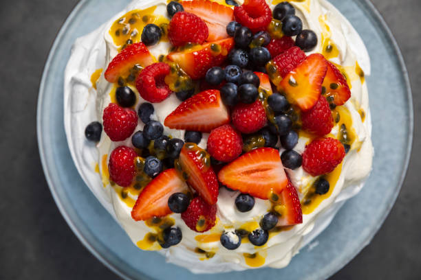 istock Pavlova dessert top down above with dark slate background 1204955118
