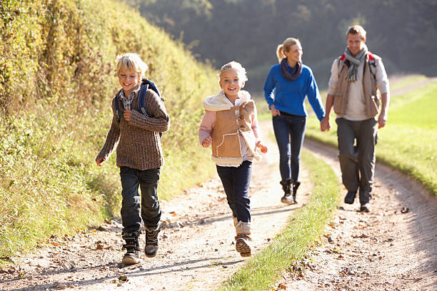 istock Young family walking in park 120495610