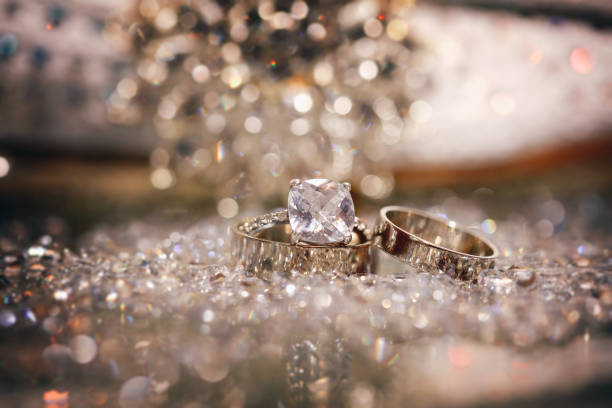 istock Wedding rings and bands on shiny reflective surfaces 1204956352