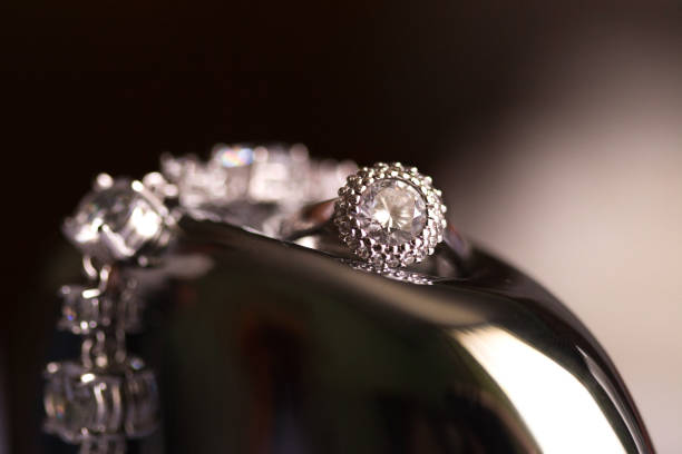 istock Wedding rings and bands on shiny reflective surfaces 1204956427