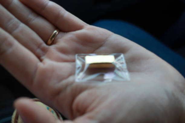 istock Gold nugget on the palm 1204956588