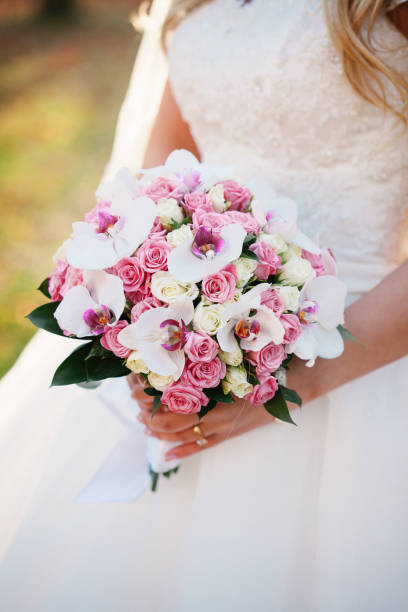 istock Bride holding her wedding bouquet 1204957538