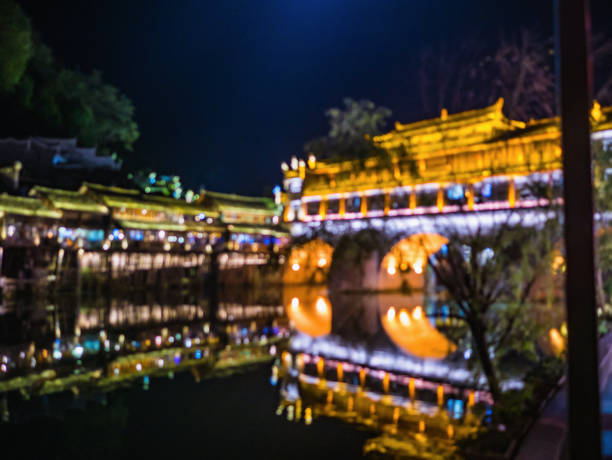 abstract Blur photo of Scenery view in the night of fenghuang old town .phoenix ancient town or Fenghuang County is a county of Hunan Province, China abstract Blur photo of Scenery view in the night of fenghuang old town .phoenix ancient town or Fenghuang County is a county of Hunan Province, China fenghuang county photos stock pictures, royalty-free photos & images