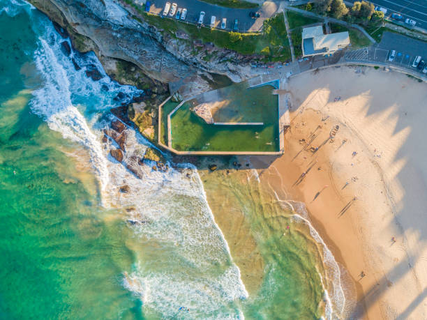 istock Surfers at the beach in Sydney, Australia 1204966796
