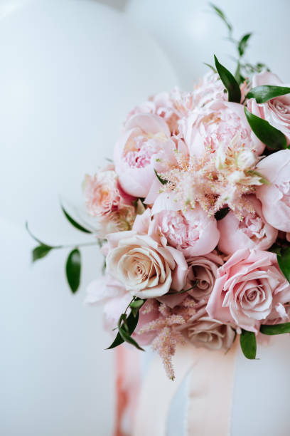 istock Fluffy pink peonies flowers background 1204971418