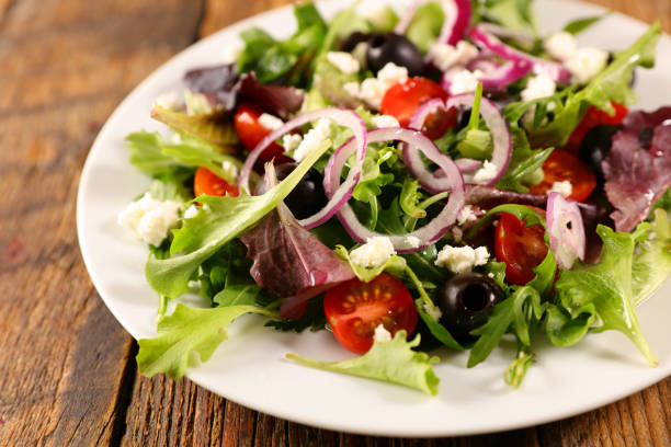 istock vegetable salad with onion, tomato, cheese and olive 1204973240