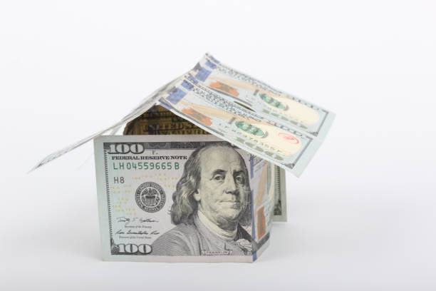 istock 100 dollar house on white background 1204975542