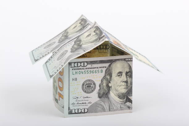 istock 100 dollar house on white background 1204975611