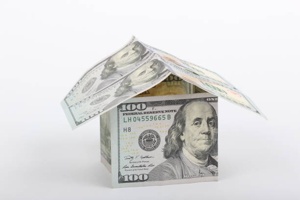 istock 100 dollar house on white background 1204975628