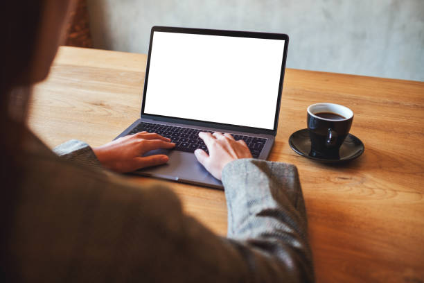 istock a woman using and typing on laptop computer with blank white desktop screen in cafe 1204976750