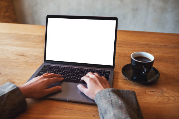 istock a woman using and typing on laptop computer with blank white desktop screen in cafe 1204976850