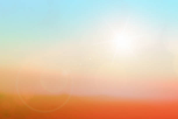 istock Natural background blurring warm colors and bright sun light. Bokeh or Christmas background Green Energy at sky sunny color orange light patterns plain abstract flare evening clouds blur. 1204977929