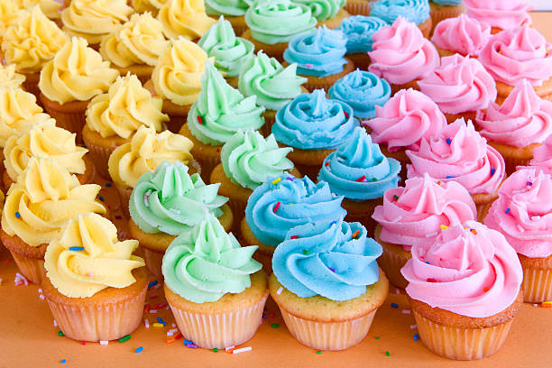 istock lots of rainbow cupcakes 120497804