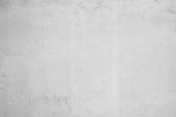 istock White concrete wall for interior or outdoor exposed surface polished. Cement have sand and stone of tone vintage, Grey natural concrete loft patterns old antique, design work floor texture background. 1204978574