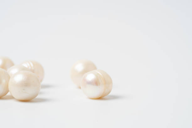 istock pearl necklace isolated on white blackground 1204980665