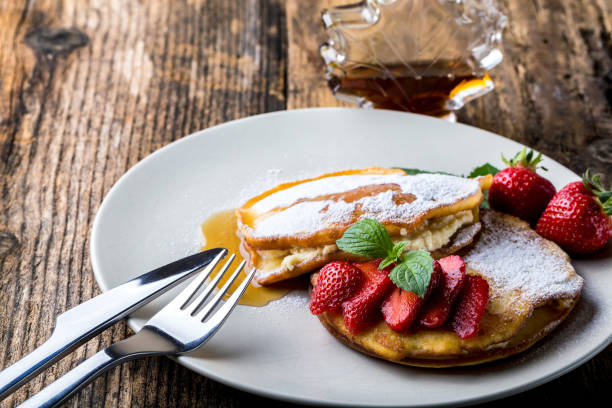 istock filled with homemade pancakes with strawberries 1204982100