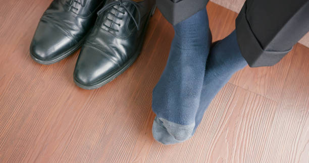 istock man with athlete foot 1204986359